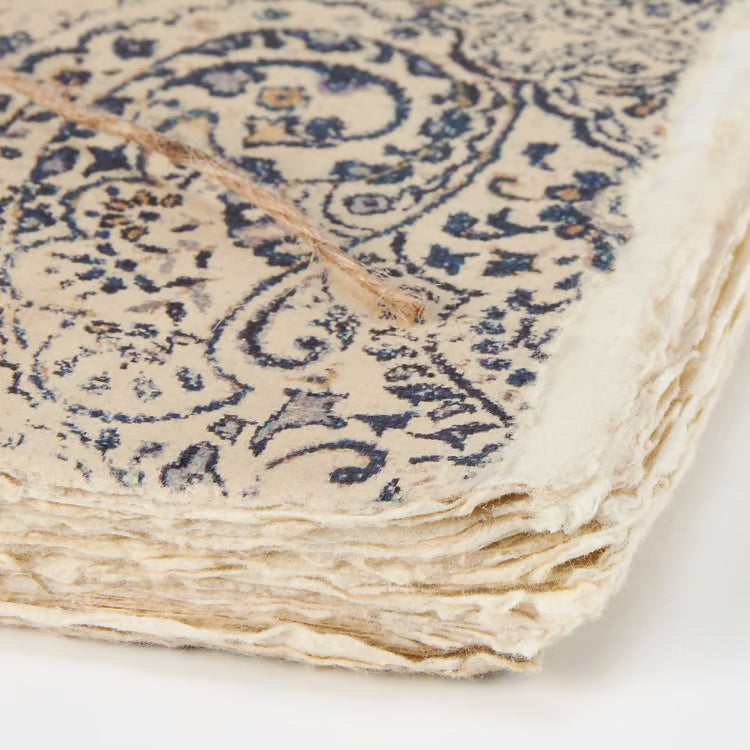 close-up of corner of journal showing deckled edge pages