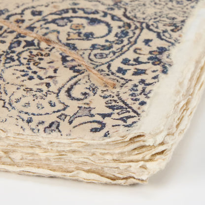 close-up of corner of journal showing deckled edge pages