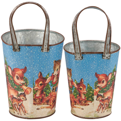 back view of metal buckets with retro style artwork of deer and evergreen