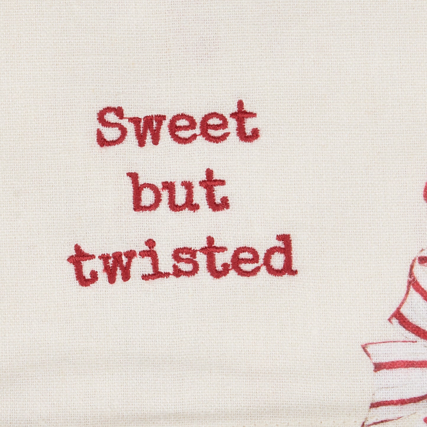 close-up of "sweet but twisted" embroidery.