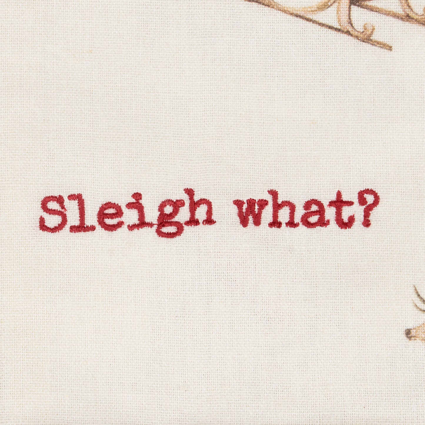 close-up of embroidered "sleigh what".