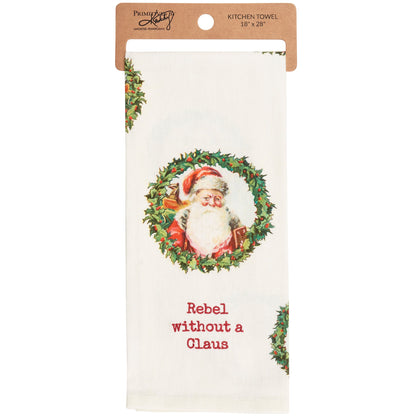 off-white hand towel with santa in wreath design and "rebel without a claus embroidered on it.