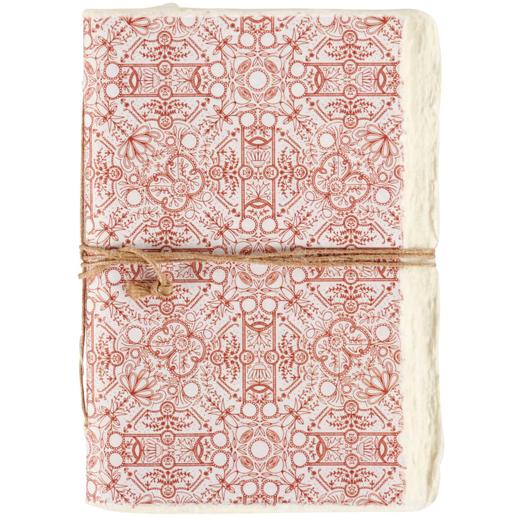 red patterned note book tied with jute