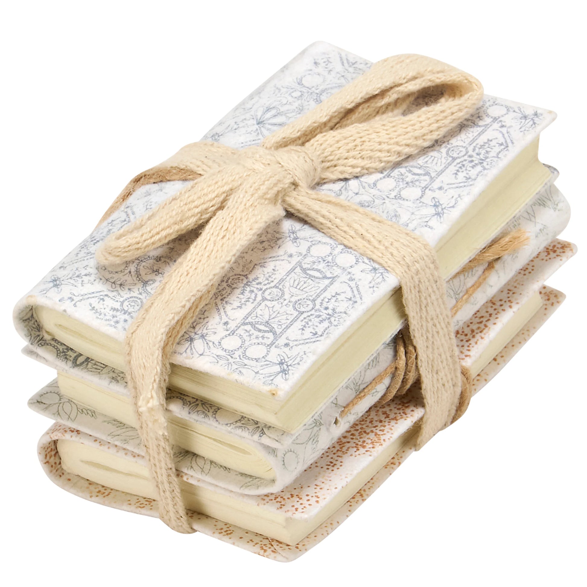 Stack of mini notebooks tied with a ribbon on a white background