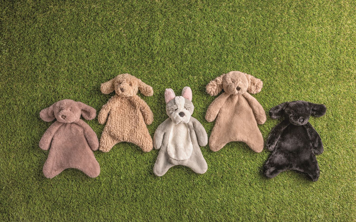 5 plush puppy woobies in the grass
