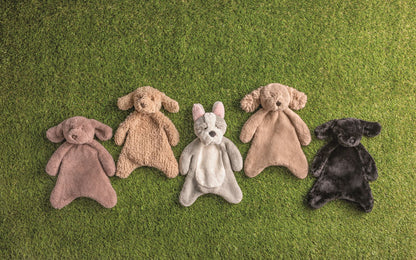 5 plush puppy woobies in the grass