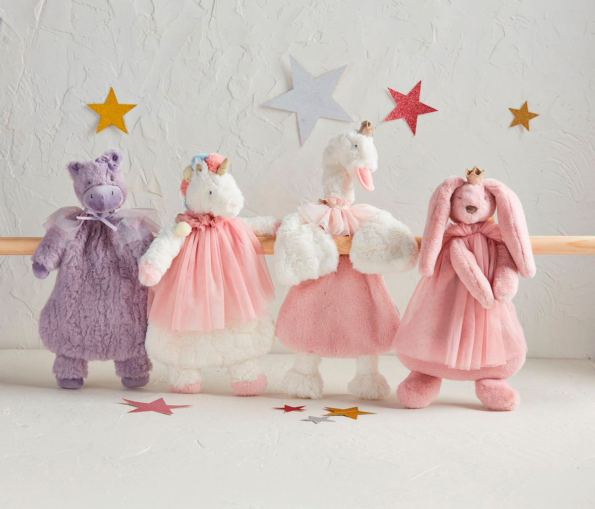 4 princess plush woobies on a dance background