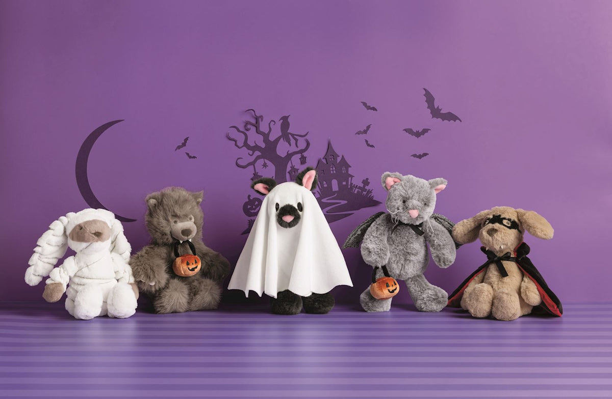 5 halloween plush pal toys on a purple background