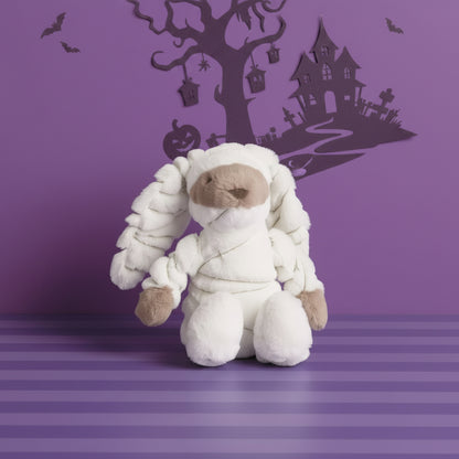 bunny mummy plush on a halloween background
