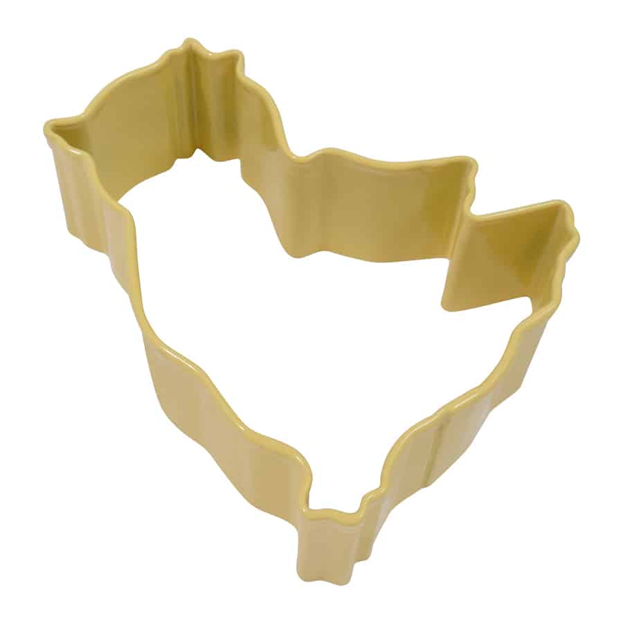 Yellow cookie cutter with a chick shape on a white background