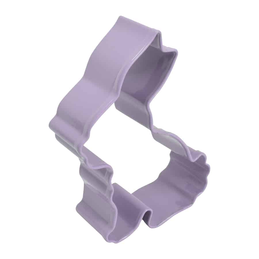 angled view of Purple bunny-shaped cookie cutter on a white background