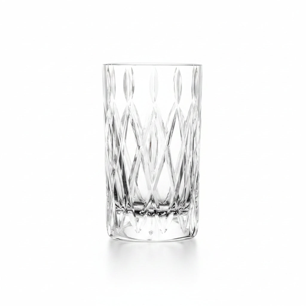 drinking glass with cut diamond design shown on a white background