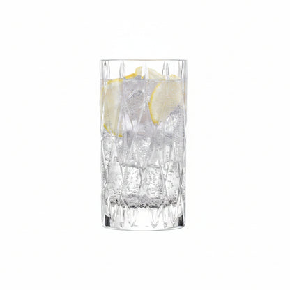 tumble drinking glass  filled with beverage and lemon slices