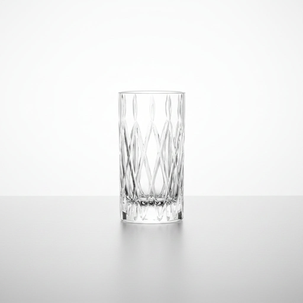 tumble drinking glass with cut diamond design shown on a white background
