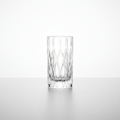 tumble drinking glass with cut diamond design shown on a white background