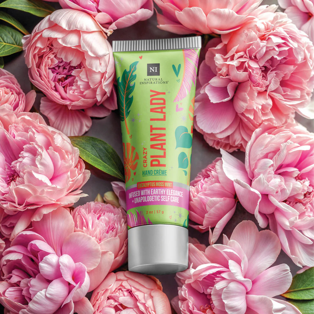 Tube of 'Crazy Plant Lady' hand cream surrounded by pink flowers