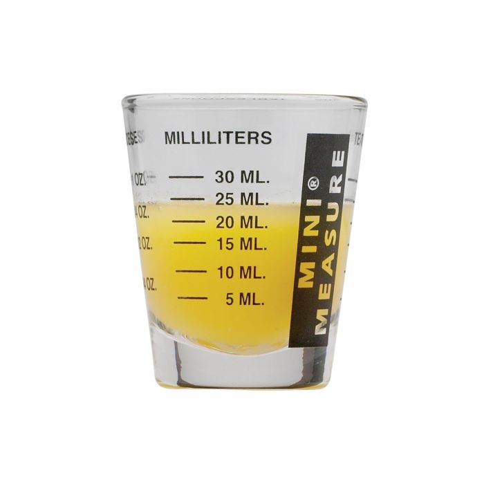 Mini Measuring Glass partially filled with liquid showing milliliter measurements