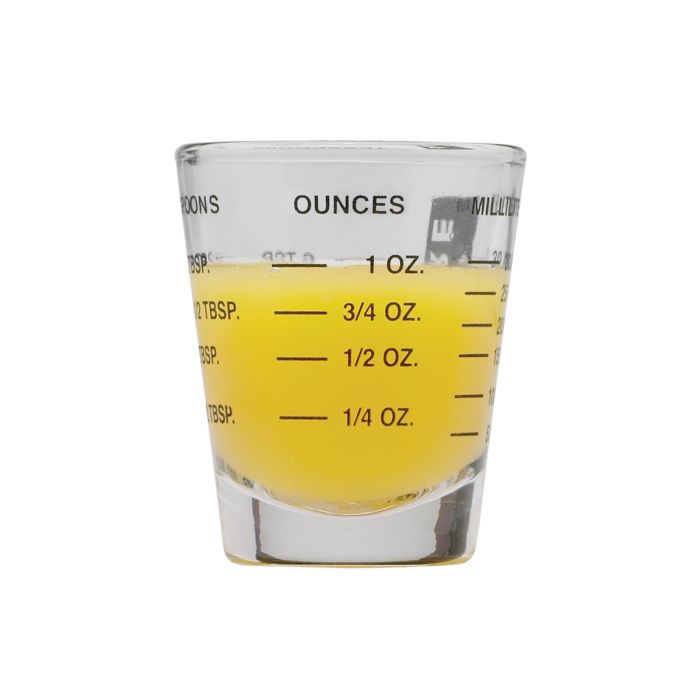 Mini Measuring Glass partially filled with liquid showing ounce measurements