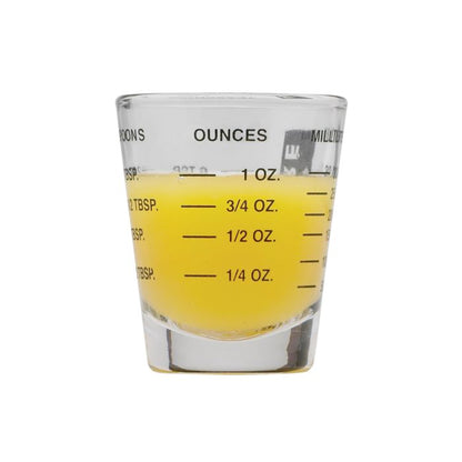 Mini Measuring Glass partially filled with liquid showing ounce measurements