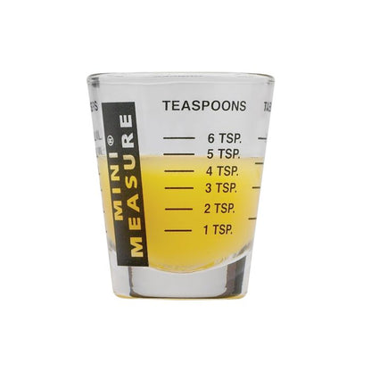 Mini Measuring Glass partially filled with liquid showing teaspoon measurements