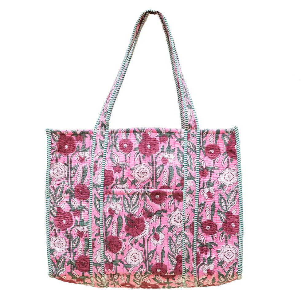 pink Floral patterned tote bag shown a white background