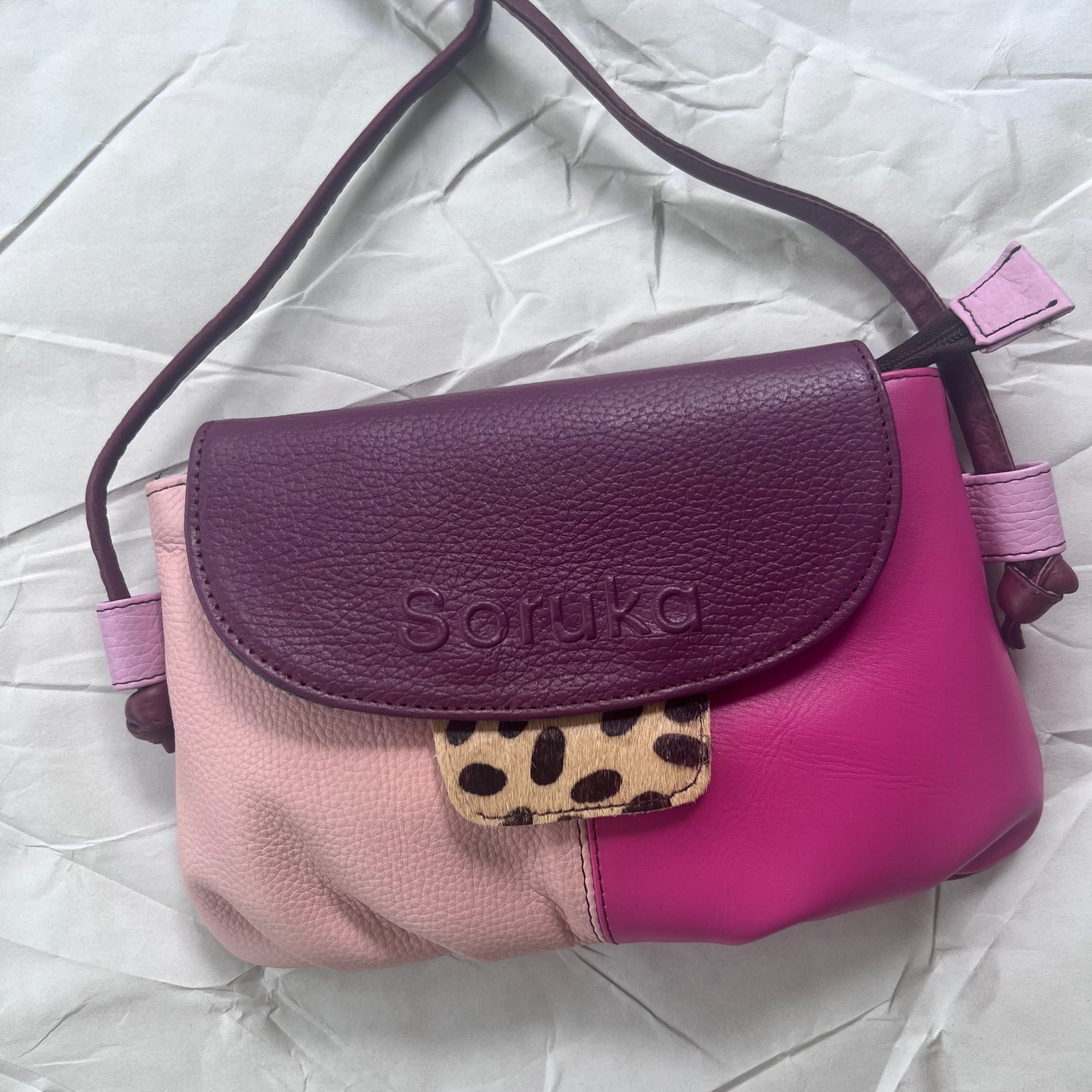 bubblegum Gianna Crossbody with animal print tab 