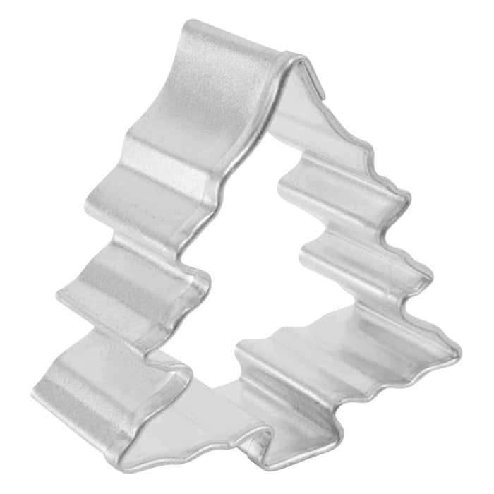 angled view of Metallic Christmas tree-shaped cookie cutter on a white background