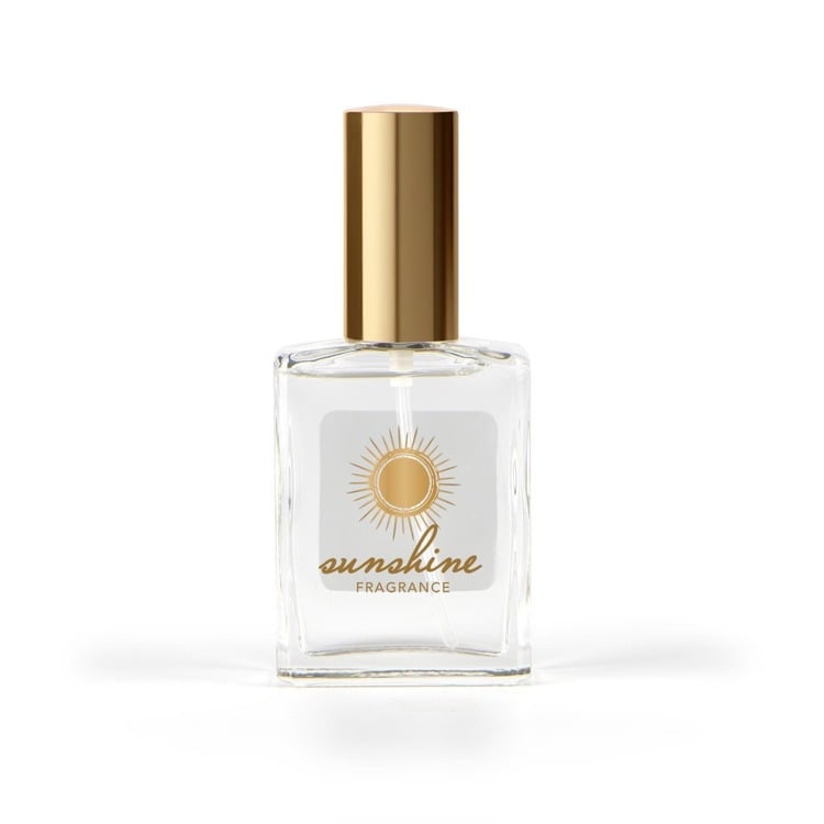 glass bottle of sunshine fragrance mist with a gold cap