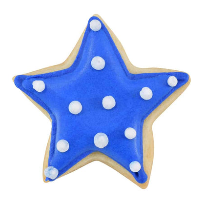Star-shaped cookie with blue icing and white dots on a white background