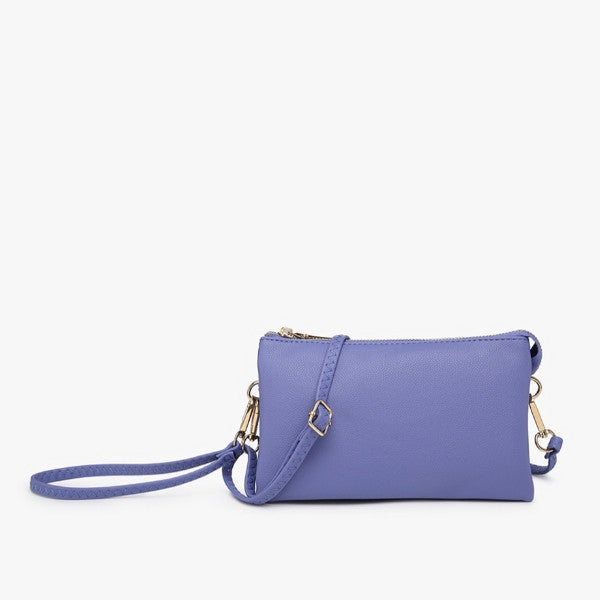 Purple handbag with a strap on a white background