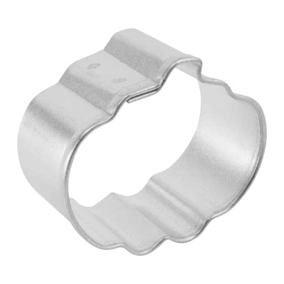 angled view of Metallic cookie cutter shaped like a pumpkin on a white background