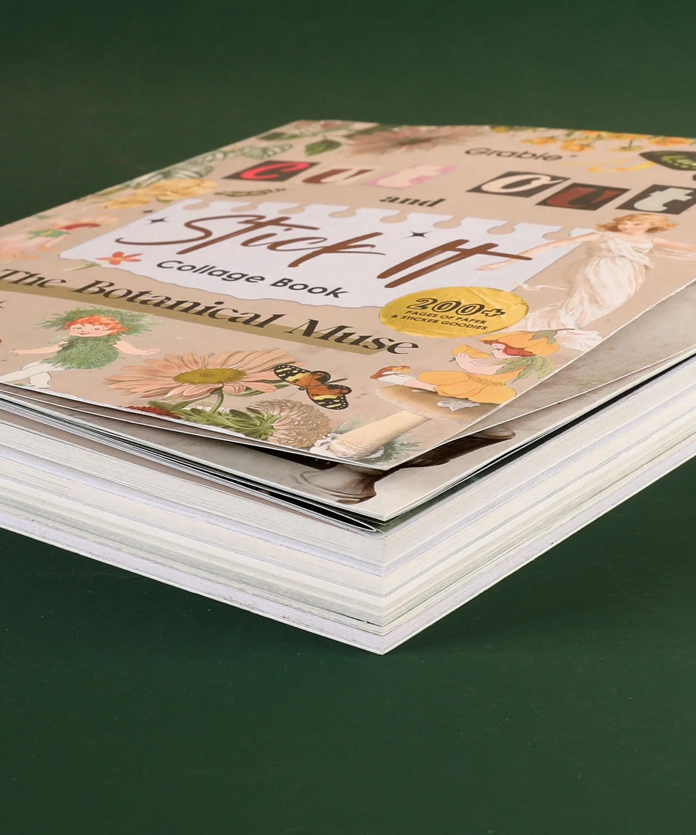 side view of Collage book titled 'Stick It' on a green background