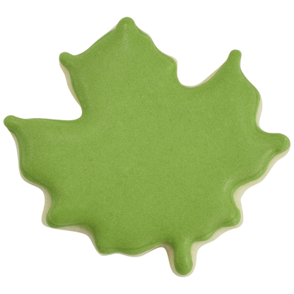 Green leaf-shaped cookie on a white background