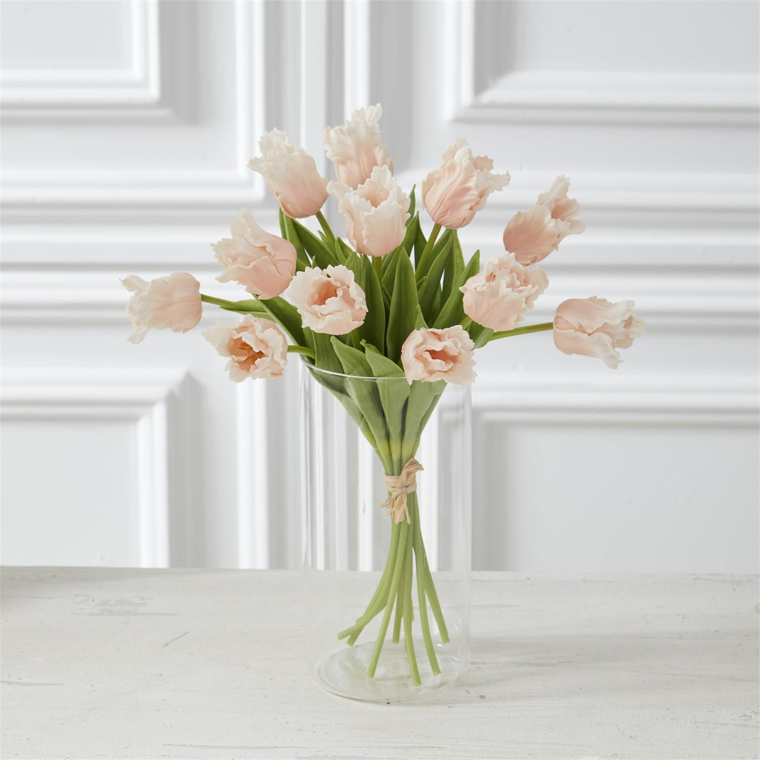 light peach parrot tulips in a glass vase