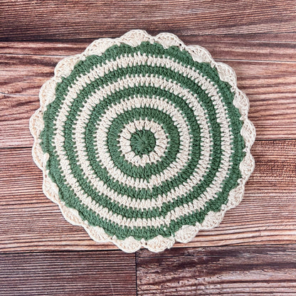 green and off-white crocheted pot holder.