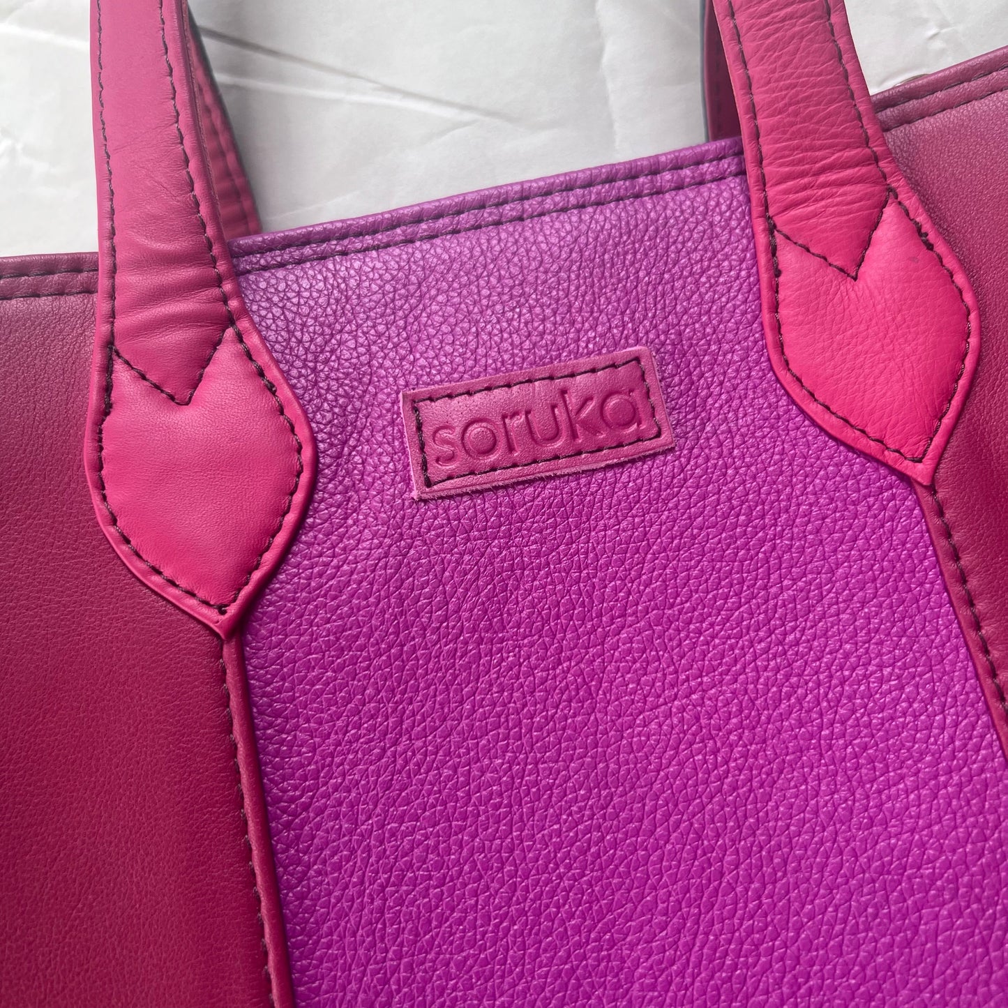 close-up of pink side of giselle tote