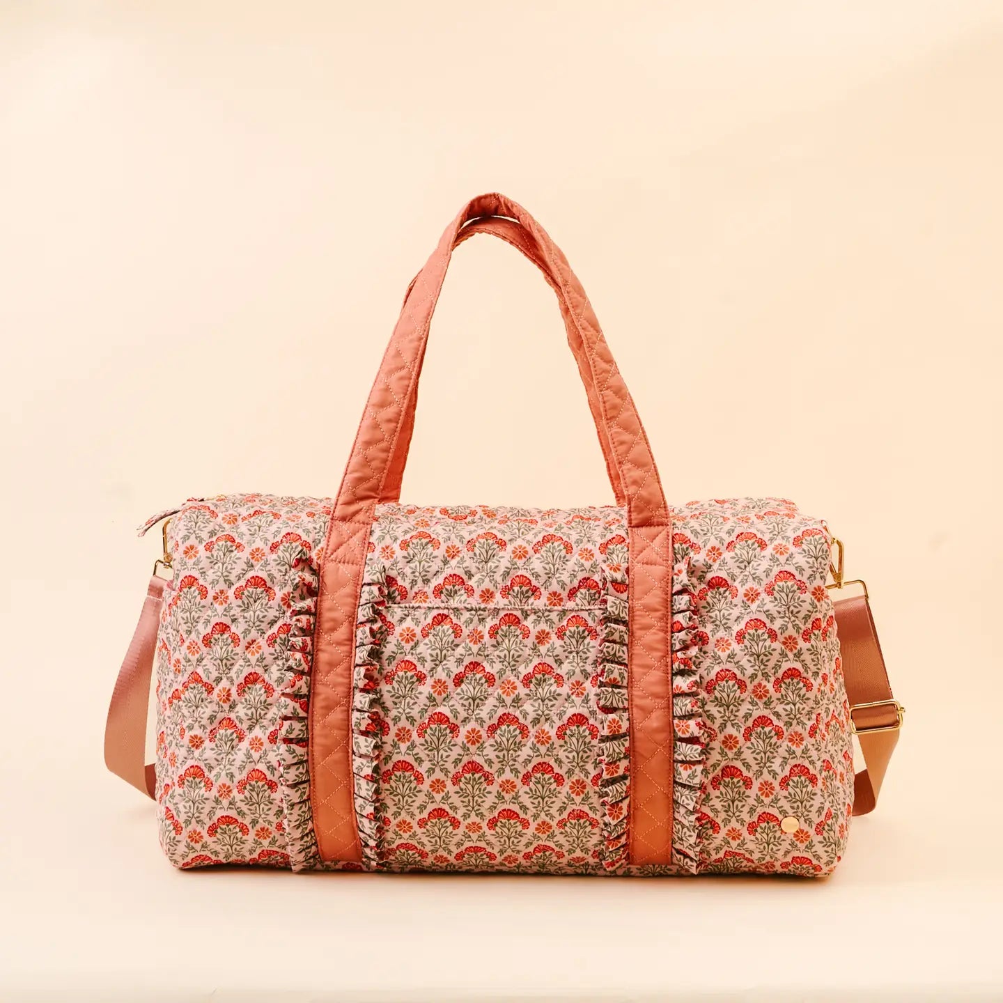 Everbloom Dusty Rose weekender bag shown on a beige background