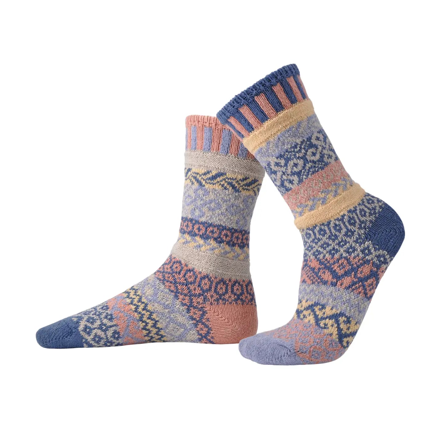pair of mismatched Mirage Crew Socks with similar but mismatched designs on a white background