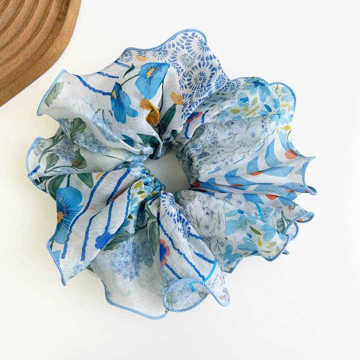 blue patchwork scrunchie on a white background
