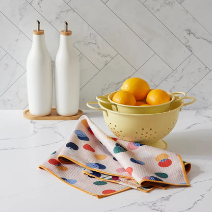Fields Of Flowers Microfiber Dishtowel draped on a counter showing dots side