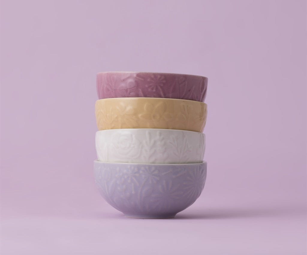 stacked In the Meadow Mini Bowl Set on a lavender background.