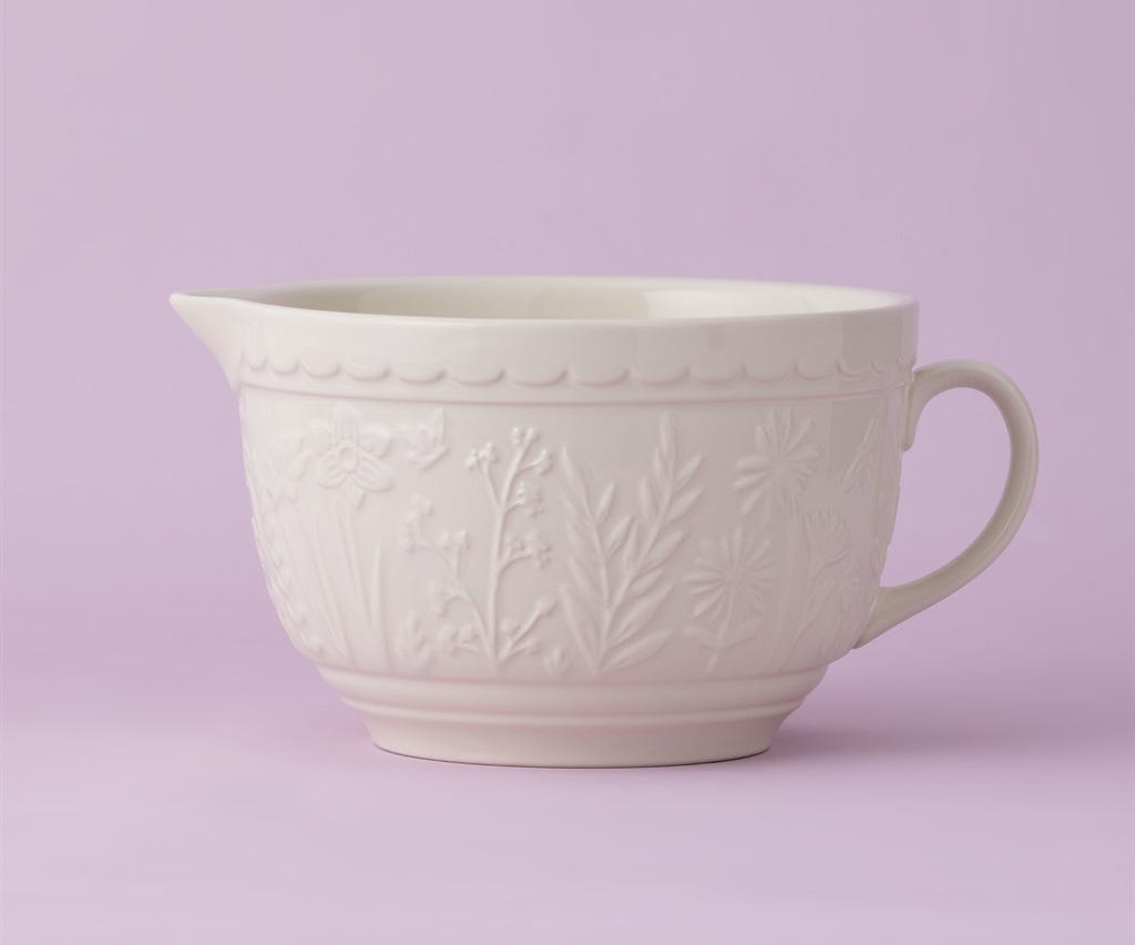 In the Meadow Cream Floral Batter Bowl on a lavender background.