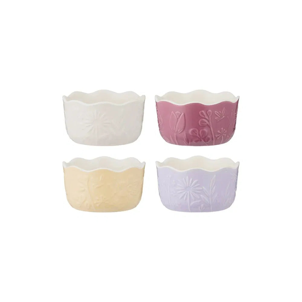Set of four floral ramekins in pastel colors on a white background