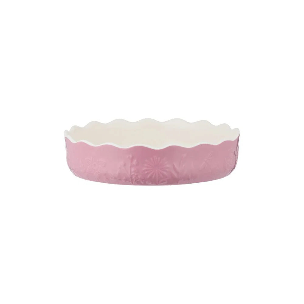 side view of pink pie dish shown on a white background