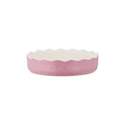 side view of pink pie dish shown on a white background