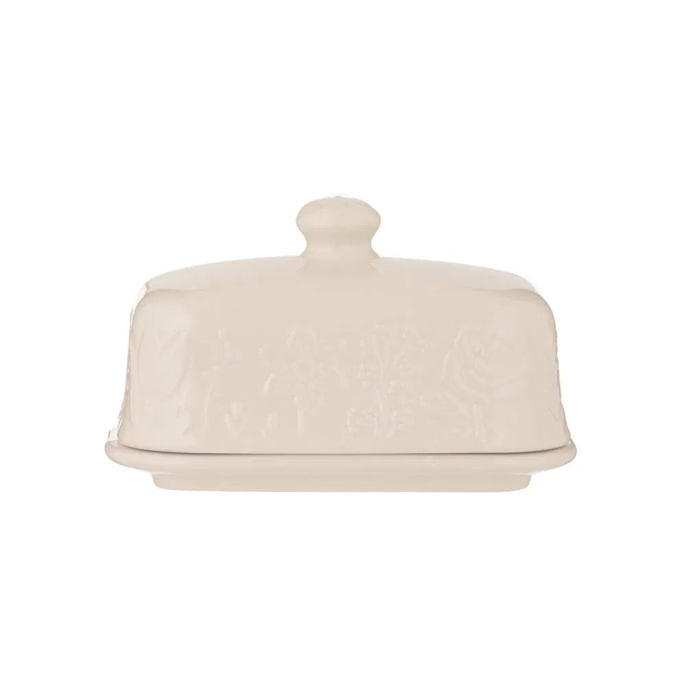 white ceramic butter dish with floral design on lid shown on a white background