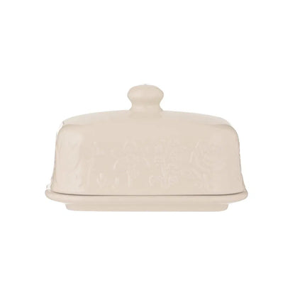 white ceramic butter dish with floral design on lid shown on a white background