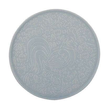 Round blue tray with a chicken design on a white background