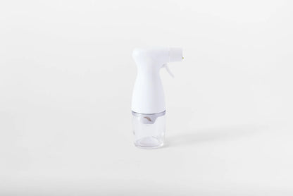 White spray bottle on a white background