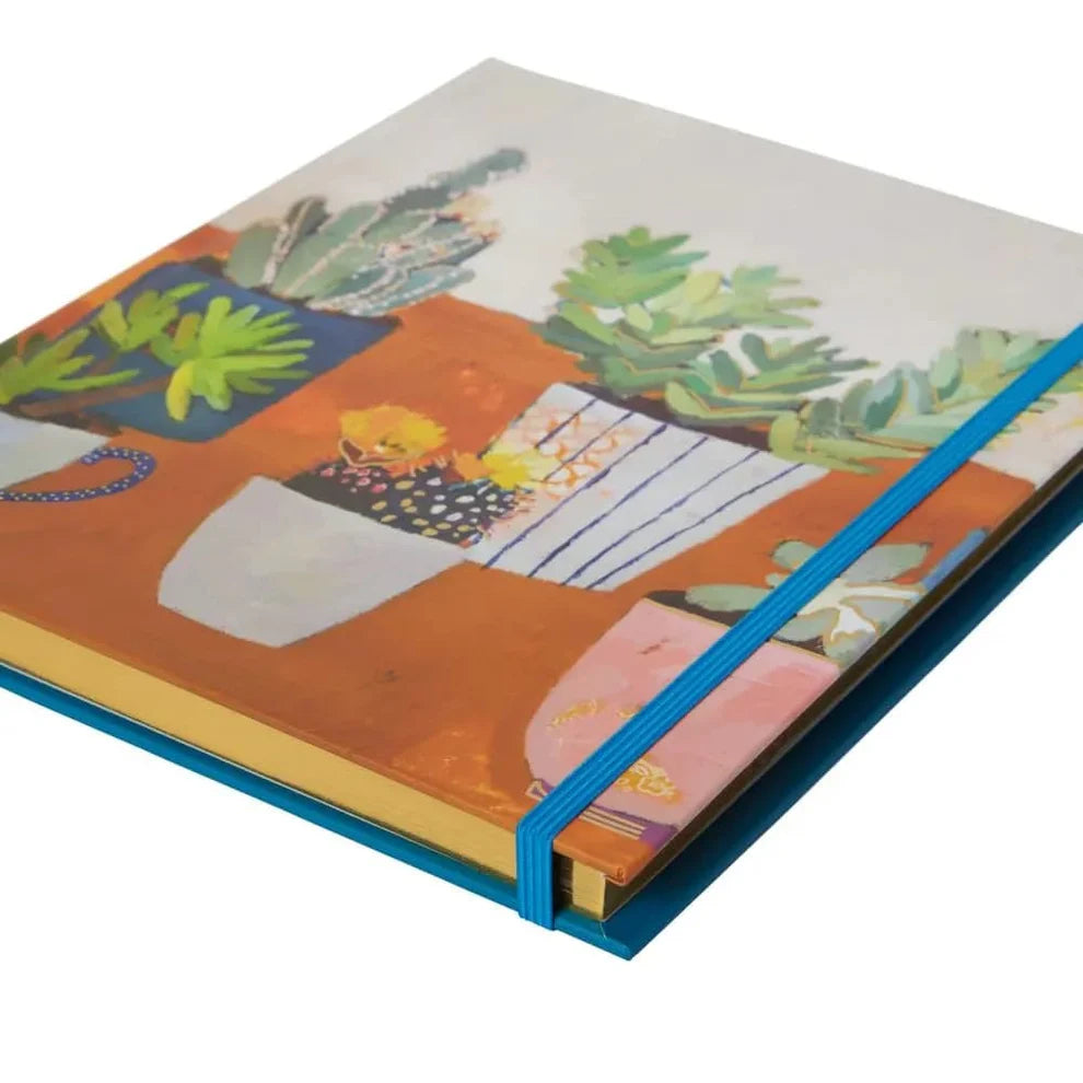 side view of houseplants notebook showing gold page edges